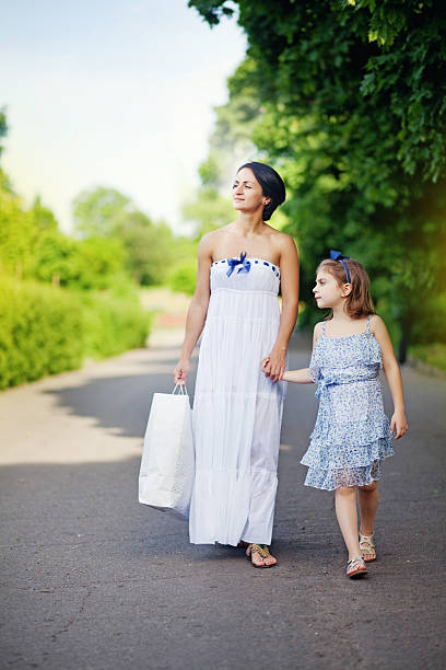 istock Mother and her daughter walking 527518551