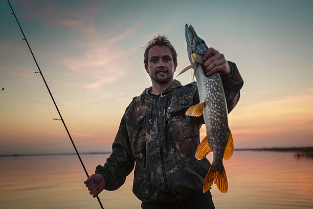 istock Man fishing on the lake 527521204