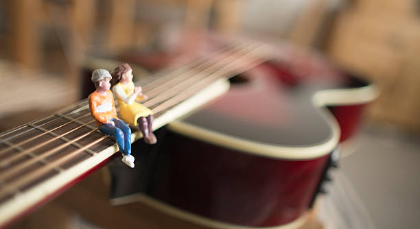 istock young couple sitting on a hug instruments 527530164