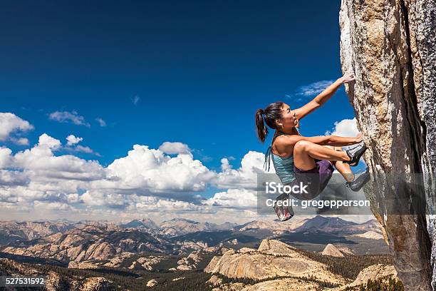 Rock Climber Clinging To A Cliff Stock Photo - Download Image Now - Rock Climbing, Mountain Climbing, Climbing