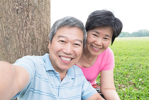 istock couple taking picture selfie 527533258