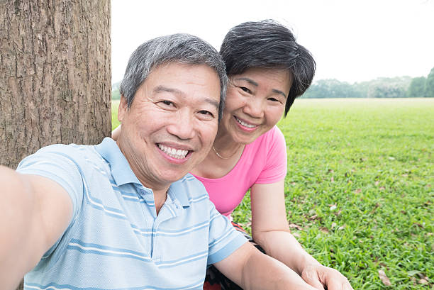 istock couple taking picture selfie 527533296