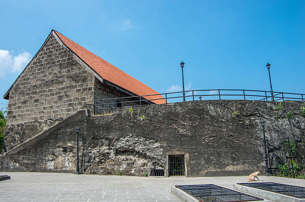 exterior of the Baclayon church on Bohol, Philippines. You can see the face of St. Padre Pio on the wall.