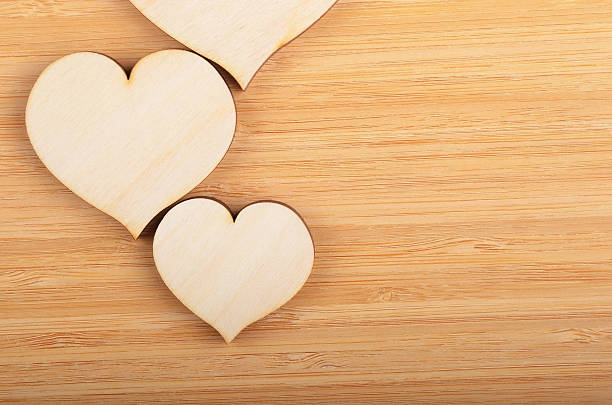 istock Heart on wooden background 527536486