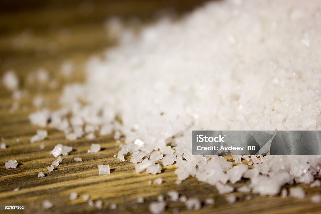 Large sea salt on wooden background Backgrounds Stock Photo