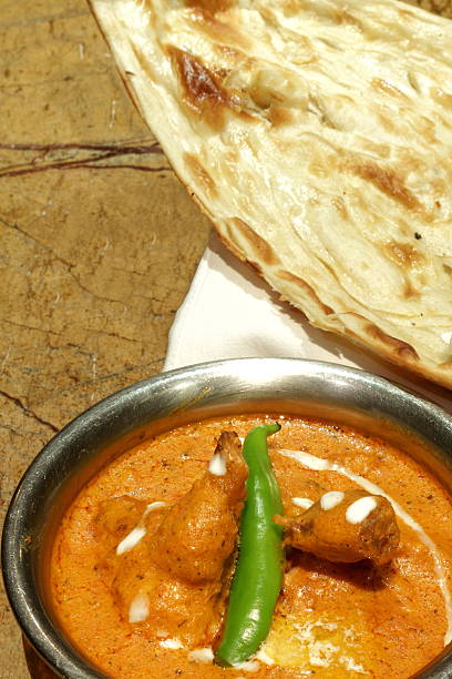 istock NAAN WITH BUTTRER CHICKEN 0R MURGH MAKHANI 527538094
