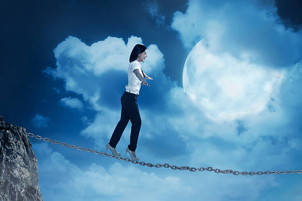 istock Business person balancing on the chain 527538550