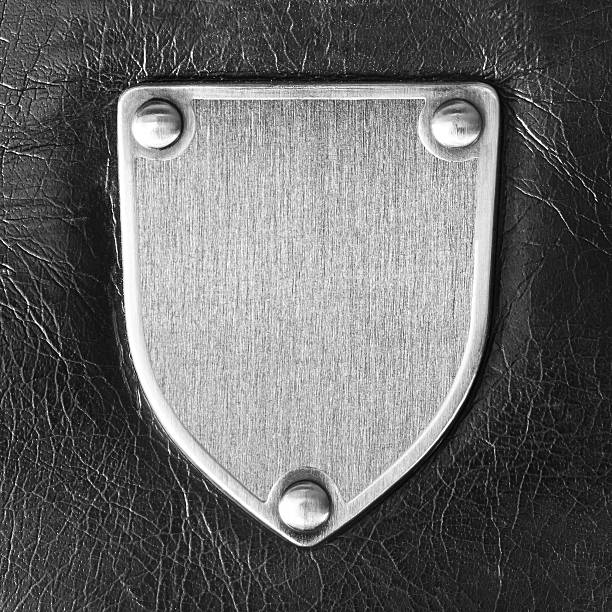 Metal badge Metal badge on a background of black leather memorial plaque photos stock pictures, royalty-free photos & images