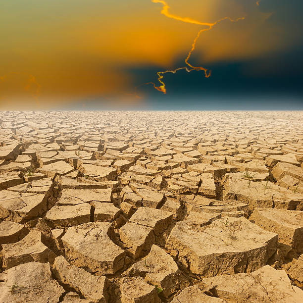 istock crack earth with beautiful sky at sunset 527540010