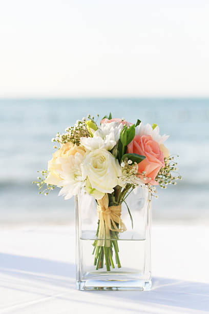 Beautiful flower in the vase wedding on the beach