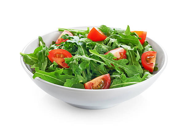 istock Bowl with fresh green salad arugula and tomatoes 527543566