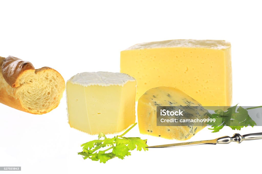 Cheese and Bread Studio shot of several kinds of cheeses and a french bread Appetizer Stock Photo