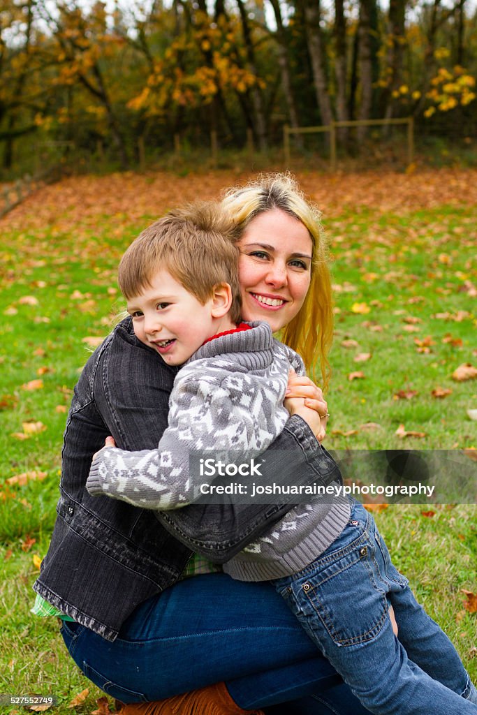 Mother Son Lifestyle Portrait Lifestyle portrait of a mother and her son outdoors in the Fall. 2-3 Years Stock Photo