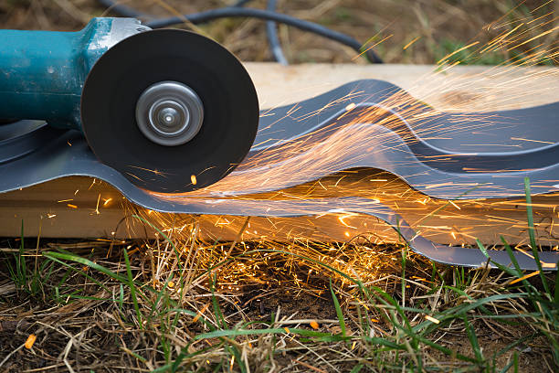 istock sharpening and cutting of iron by abrasive disk machine 527556579