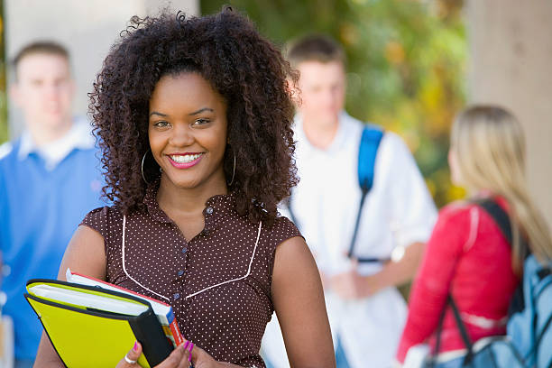 istock Smiling Female Student On College Campus 527558103