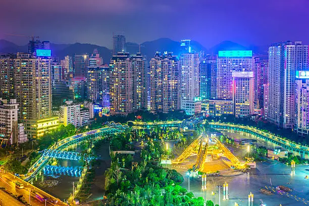 Guiyang, China cityscape over People's Square at night.