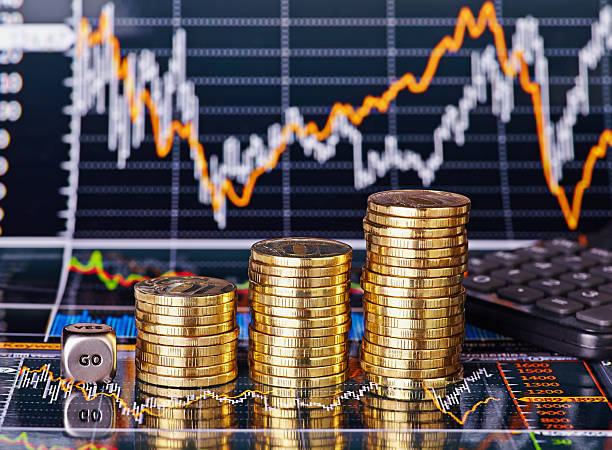istock Uptrend stacks coins, dices cube  GO and calculator 527564895