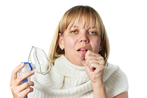 istock Sick cough woman holding inhaler isolated 527564931