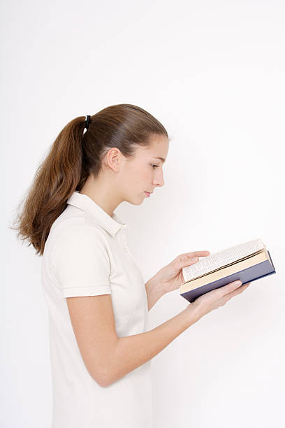 istock Young woman, reading book 527569133