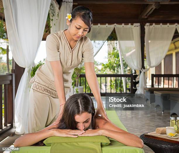 Young Woman Having A Massage Treatment Stock Photo - Download Image Now - Luxury, Wealth, Wellbeing