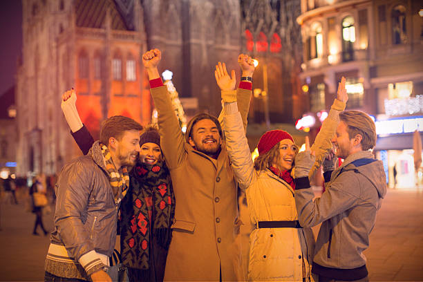 istock Friends having fun outdoors in winter city. 527579865