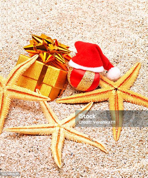 Christmas Ball Starfishes And A Gift Box On Sand Stock Photo - Download Image Now - Beach, Beauty, Box - Container