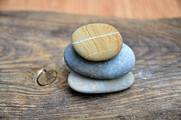 istock Three Zen stones on ols used wood 527582291