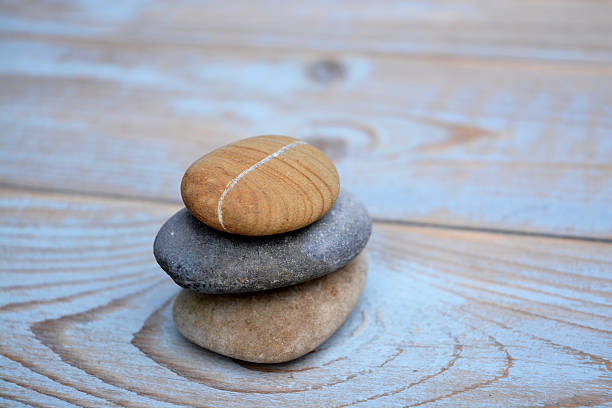 istock Three Zen stones on ols used wood 527582607