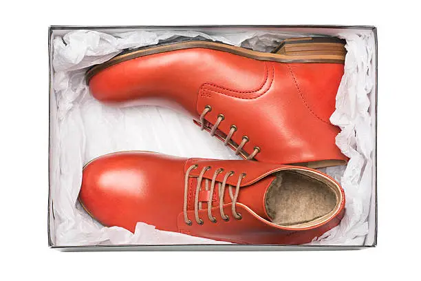 Photo of new red shoes in box