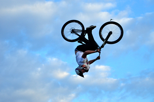 Bontida, Romania - June 21, 2014: BMX rider making a bike jump during the BMX Competition, at Electric Castle Festival