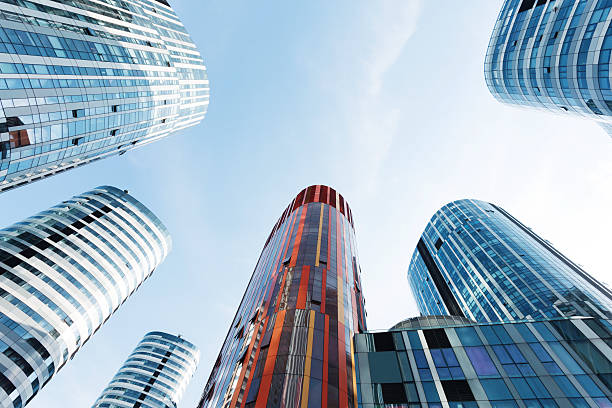 istock up looking the modern business office building exterior and sky 527611011
