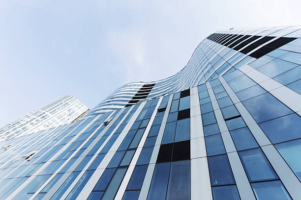 istock up looking the modern business office building exterior and sky 527611021