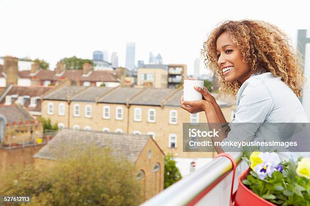 Woman Relaxing Outdoors On Rooftop Garden Stock Photo - Download Image Now - Balcony, London - England, Women