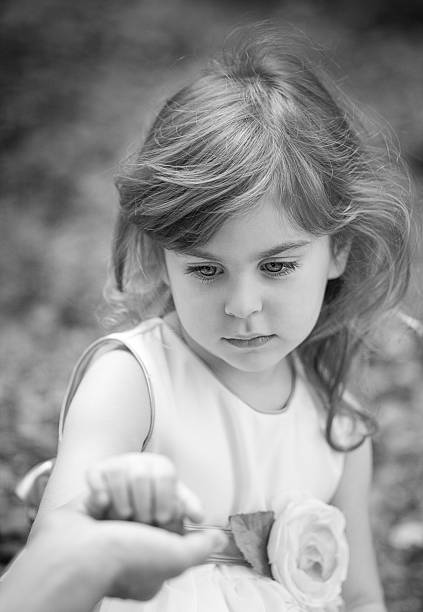 istock Girl holding her mother's hand black&white 527612157