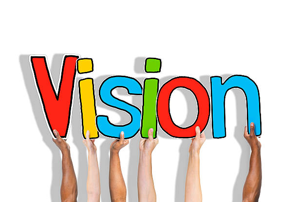 istock Group of Hands Holding Letter Vision 527612279