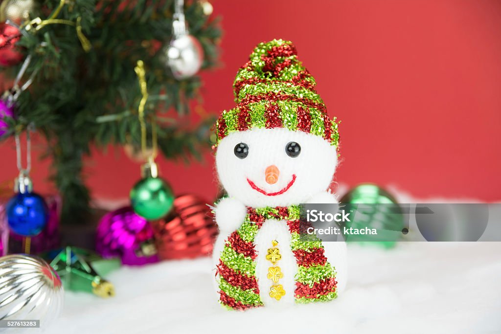 Snow man and white Christmas balls with gift Snow man and white Christmas balls with gift on red background, concept christmas 2014 Stock Photo