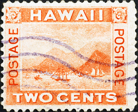 Old postage stamp of Hawaii issued in 1899. A drawing of a bay with sail ships.