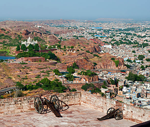 View of the city, Jaswant Thada and historical cannons on Mehrangarh Fort in Jodhpur, Rajasthan, India