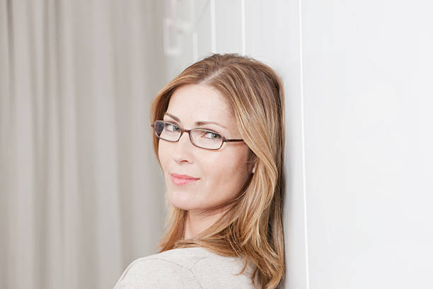 istock Woman with glasses smiling looking at camera 527617331