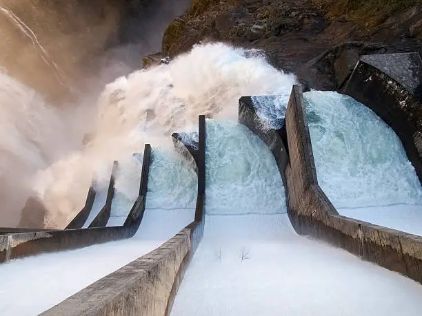 Dam of Contra Verzasca Ticino, Switzerland: spectacular waterfalls from the overflow of the lake