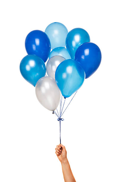 Blue Balloons Blue Balloons in hand isolated on white background helium stock pictures, royalty-free photos & images