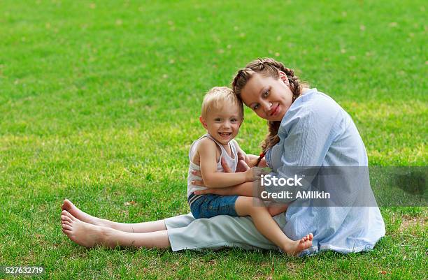 Pregnant Woman And Her Son Smiling Stock Photo - Download Image Now - 2-3 Years, 30-39 Years, Adult