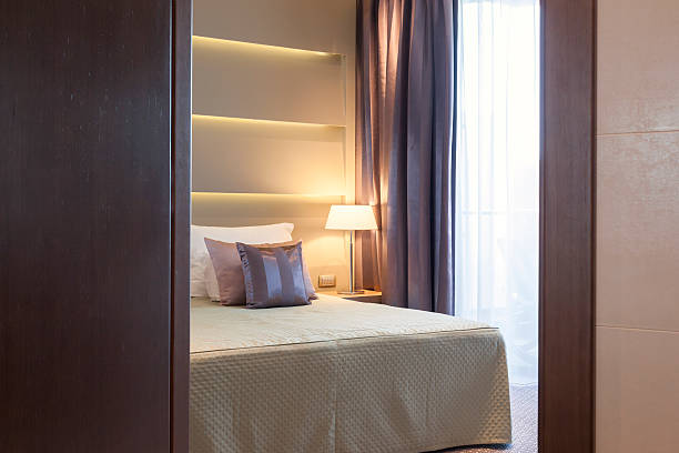 istock Shot of bedroom through half closed door 527633209