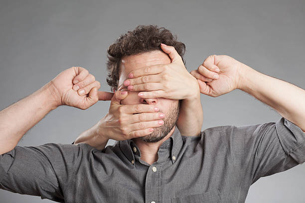 Man not seeing not hearing not saying anything