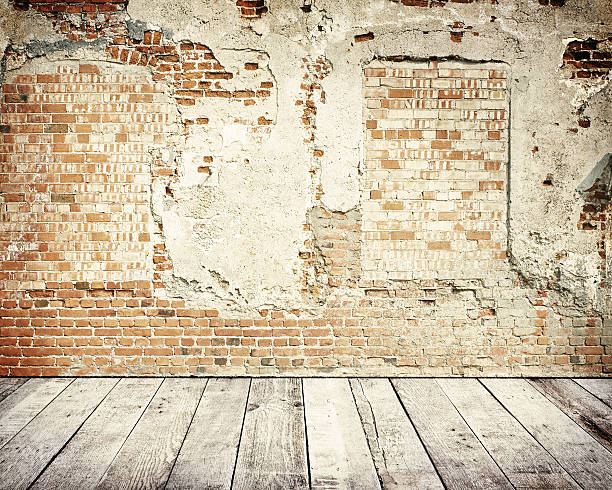 istock Tall brick wall with wooden floor 527634151