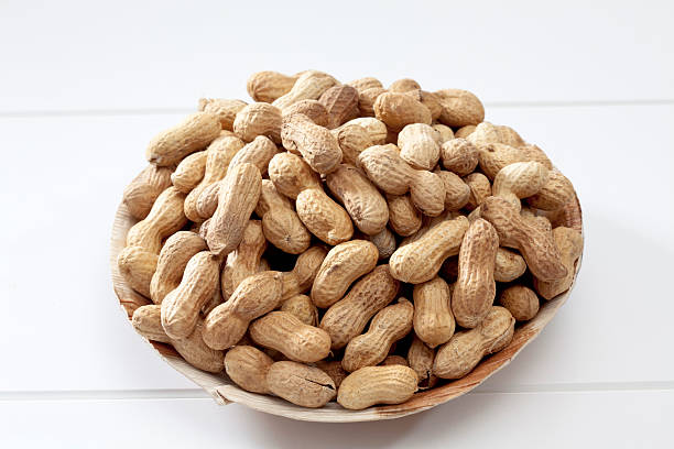 istock Heap of peanuts on plate 527634247