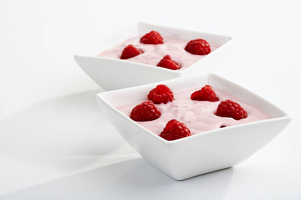 istock Raspberries and yoghurt in bowls 527635709