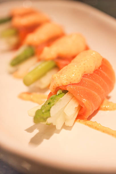 istock Closeup salmon mentai sauce  on white plate 527635909