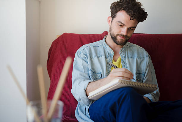 istock handsome hipster modern man painting 527635915