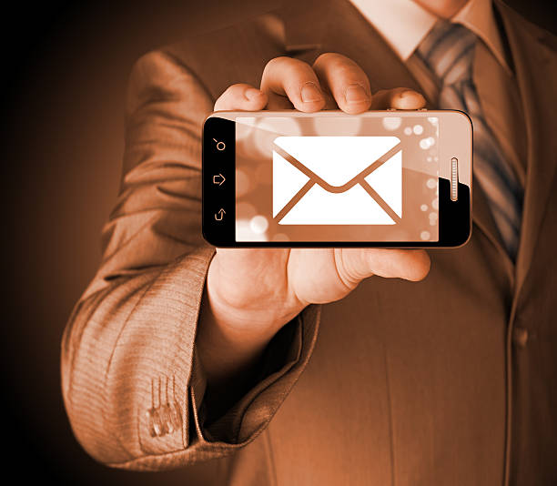 istock man holding smartphone with one new message on a screen. 527636237